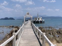 Long pier out to a small Buddhist alter
